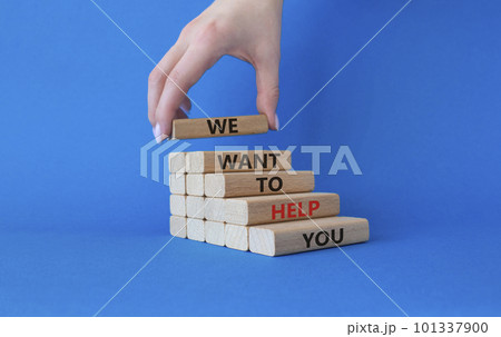 We want to help you symbol. Wooden blocks with words We want to help you. Beautiful blue background. Businessman hand. Business and We want to help you concept. Copy space. 101337900