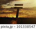 Tenge money sign at sunset in the rays of the setting sun. Sunset currency. Devaluation of money. 101338547