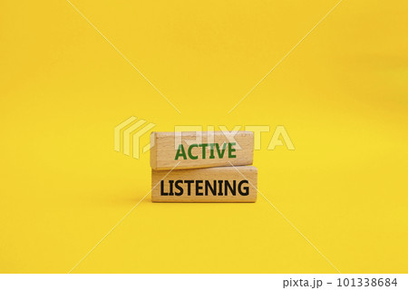 Active listening symbol. Wooden blocks with words Active listening. Beautiful yellow background. Business and Active listening concept. Copy space. 101338684