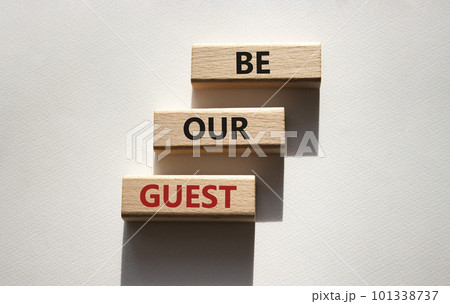 Be our guest symbol. Concept word Be our guest on wooden blocks. Beautiful white background. Business and Be our guest concept. Copy space Be our guest symbol. Concept word Be our guest on wooden blocks. Beautiful white background. Business and Be our guest concept. Copy space 101338737