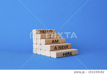 Hello I am a new hire symbol. Concept words Hello I am a new hire on wooden blocks. Beautiful blue background. Business and Hello I am a new hire concept. Copy space. Hello I am a new hire symbol. Concept words Hello I am a new hire on wooden blocks. Beautiful blue background. Business and Hello I am a new hire concept. Copy space. 101339182