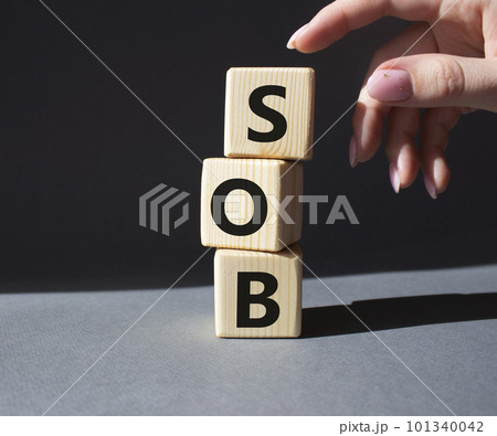 SOB - Shortness of breath symbol. Wooden cubes with words SOB. Doctor hand. Beautiful grey background. Medical and SOB concept. Copy space. 101340042