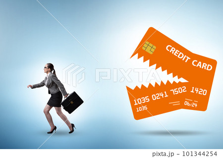 Businesswoman in credit card debt concept Businesswoman in credit card debt concept 101344254