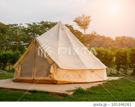 Camping picnic tent campground in outdoor hiking forest. Camper while campsite in nature background at summer trip camp. Adventure Travel Vacation concept 101346261