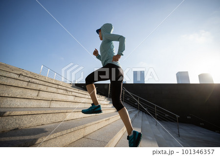 Fitness sports woman running up stairs in city Fitness sports woman running up stairs in city 101346357