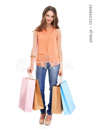 Woman, retail portrait and shopping packaging in studio for fashion market, designer girl vision and luxury boutique brand. Customer, clothing product or shopping bag in white background in studio 101348092