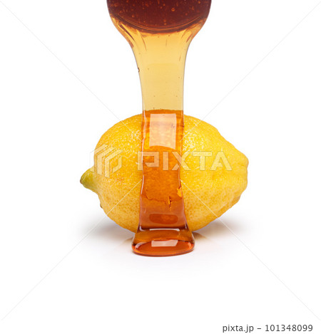 The feel-good combination. Studio shot of honey being poured on top of a lemon against a white background. 101348099