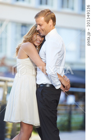 Love, couple and hug outdoor, city and happiness for Valentines day, dating and cheerful together. Romance, man and woman embrace in town, celebrate relationship and happy with hope and marriage 101349136