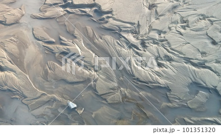 Dirty wet sand, grunge horizontal shabby background close-up. Blurry image of sand pattern. Abstract nature background. Dirty wet sand, grunge horizontal shabby background close-up. Blurry image of sand pattern. Abstract nature background. 101351320