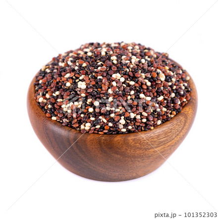 Quinoa seeds in wooden bowl, isolated on white background. Mix of white, red and black quinoa. Quinoa seeds in wooden bowl, isolated on white background. Mix of white, red and black quinoa. 101352303
