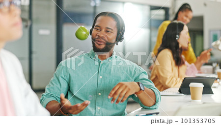 Call center, consulting or black business man with apple on computer for telemarketing, customer service contact us. Communication, sales or crm employee at help desk with fruit for technical support 101353705