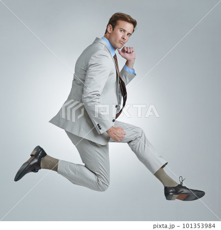 Business ego. A young businessman wildly celebrating his success. 101353984