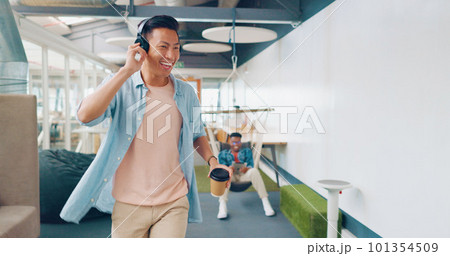 Businessman, dancing headphones or walking in modern office, coworking space or teamwork marketing company with freedom energy. Smile, happy or music dance for worker or creative designer with coffee Businessman, dancing headphones or walking in modern office, coworking space or teamwork marketing company with freedom energy. Smile, happy or music dance for worker or creative designer with coffee 101354509