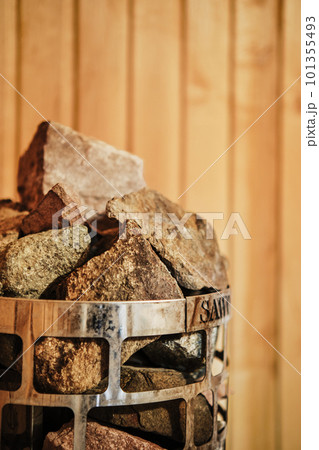 Closeup view of rocks and stones in cage in sauna heater 101355493