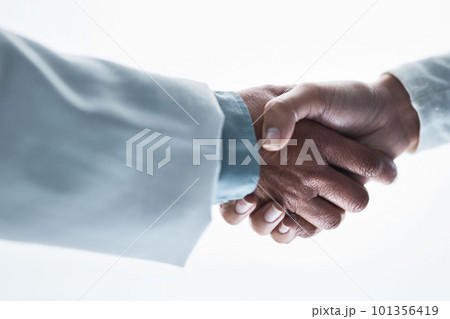Doctors, women and handshake on isolated white background for healthcare, wellness deal or teamwork collaboration. Zoom, medical and partnership gesture in hospital welcome, people trust or thank you 101356419