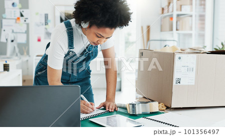 Delivery, ecommerce and shipping with woman writing logistics information from laptop for online shopping, product or checklist. Storage, stock and cargo with employee in retail warehouse factory Delivery, ecommerce and shipping with woman writing logistics information from laptop for online shopping, product or checklist. Storage, stock and cargo with employee in retail warehouse factory 101356497