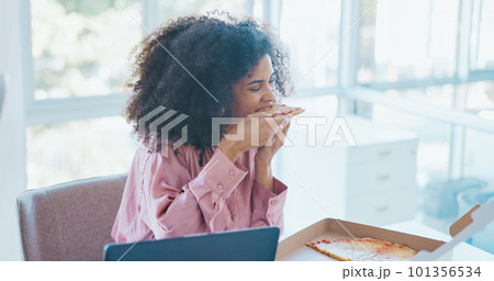 Business woman, pizza and eating in office, enjoy lunch with fast food meal and hungry while working. Professional black woman on break, food and nutrition with success and satisfaction. 101356534