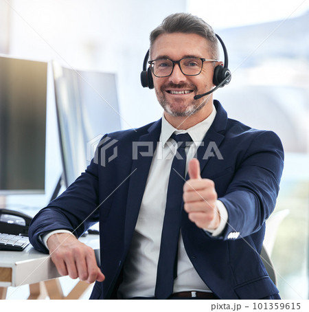 Thumbs up, yes and success deal for a call center agent with contact us and happy about telemarketing. Portrait of a CRM manager or customer service employee smiling due to good business 101359615