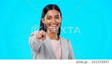 Portrait, pointing and you with a woman on a blue background in studio for option, selection or choice. Smile, happy and we are hiring with a young female employee in business making a decision Portrait, pointing and you with a woman on a blue background in studio for option, selection or choice. Smile, happy and we are hiring with a young female employee in business making a decision 101359947