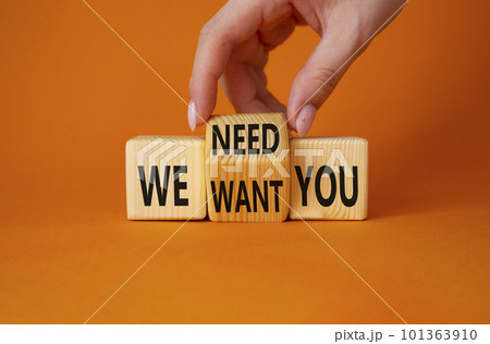 We need and want You symbol. Businessman Hand turns cubes and changes word We want you to We need you. Beautiful orange background. Business and We need and want You concept. Copy space 101363910
