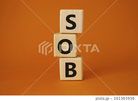 SOB - Shortness of breath symbol. Wooden cubes with words SOB. Beautiful orange background. Medical and SOB concept. Copy space. SOB - Shortness of breath symbol. Wooden cubes with words SOB. Beautiful orange background. Medical and SOB concept. Copy space. 101363936