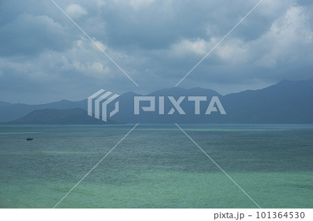 Beautiful seascape. Calm ocean against misty mountains. Beautiful seascape. Calm ocean against misty mountains. 101364530