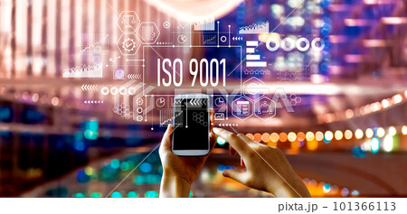 ISO 9001 theme with big city at night ISO 9001 theme with big city at night 101366113
