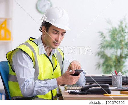 Young male architect working in the office Young male architect working in the office 101370291