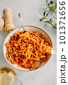 Pasta bavette with fried shrimps, bechamel sauce. Woman hands in frame, girl eats pasta, holds fork in hands, top view, italian cuisine. 101371656
