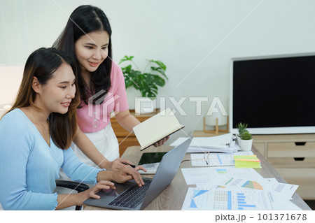 Financial analysts analyzing business reports on planned investment projects during corporate meeting discussions showcase successful teamwork with marketing plan, computers and calculators to work. Financial analysts analyzing business reports on planned investment projects during corporate meeting discussions showcase successful teamwork with marketing plan, computers and calculators to work. 101371678