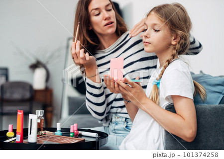Mother and daughter do a makeover at home 101374258