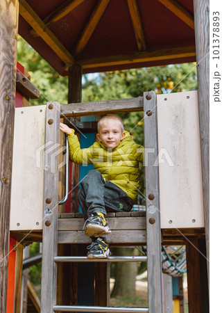 Boy At The Climbing Wall Without A Helmet, Danger At The Climbing Wall. Little Boy Climbing A Rock Wall Indoor Boy At The Climbing Wall Without A Helmet, Danger At The Climbing Wall. Little Boy Climbing A Rock Wall Indoor 101378893