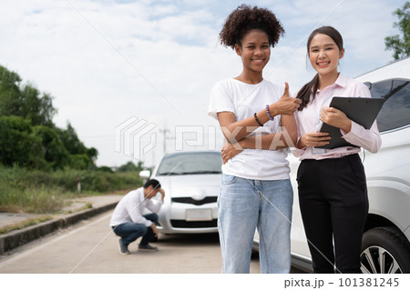 Women drivers Talk to Insurance Agent for examining damaged car and customer checks on the report claim form after an accident. Concept of insurance, advice auto repair shop and car traffic accidents. Women drivers Talk to Insurance Agent for examining damaged car and customer checks on the report claim form after an accident. Concept of insurance, advice auto repair shop and car traffic accidents. 101381245