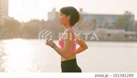 asian female jogging in city 101381260