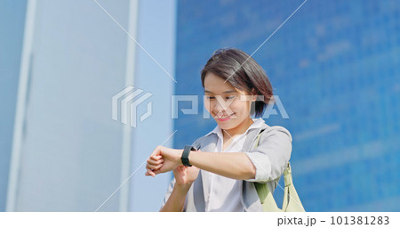 businessfemale look on smart watch businessfemale look on smart watch 101381283