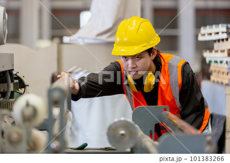 Male workers wear red helmet working check up iron production in factory Male workers wear red helmet working check up iron production in factory 101383266