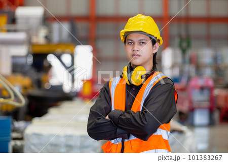 Portrait man engineer worker industry wearing safety uniform and hard hat crossed arms 101383267