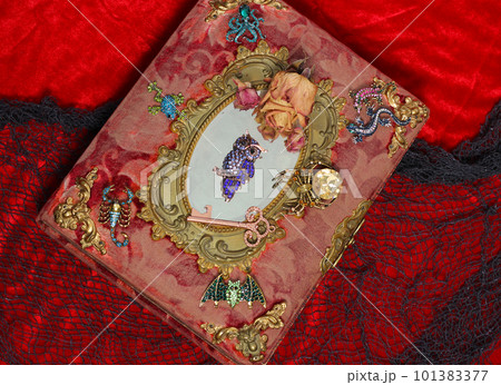 Antique Victorian Era Book With Colorful Gemstones added. Fairy Tale Scary Book With Scorpion and Bat 101383377