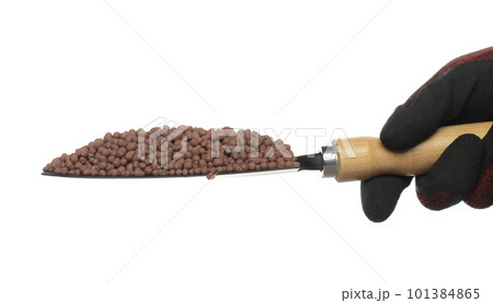 Clay Drainage tiny size ball pour fall down, explosion in shovel hand. Clay Drainage ball splash in shape form line explosion. White background isolated high speed shutter freeze motion Clay Drainage tiny size ball pour fall down, explosion in shovel hand. Clay Drainage ball splash in shape form line explosion. White background isolated high speed shutter freeze motion 101384865