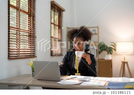 Accountant black woman working on laptop and do document, tax, exchange, accounting and Financial advisor concept 101386115