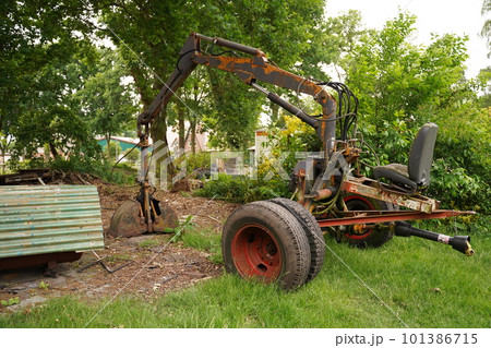 Mini excavator. Mini digger parked, excavation work outdoors 101386715