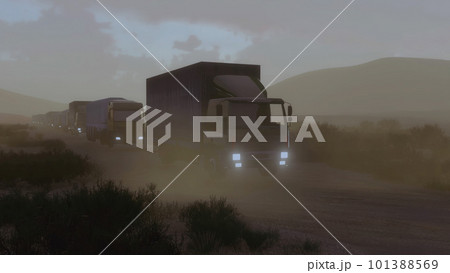 Military trucks ride on desert road at night 101388569