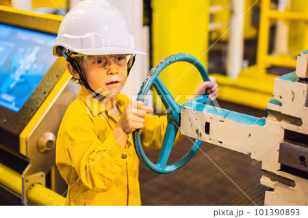 Boy operator recording operation of oil and gas process at oil and rig plant, offshore oil and gas industry, offshore oil and rig in the sea, operator monitor production process, routine daily record 101390893