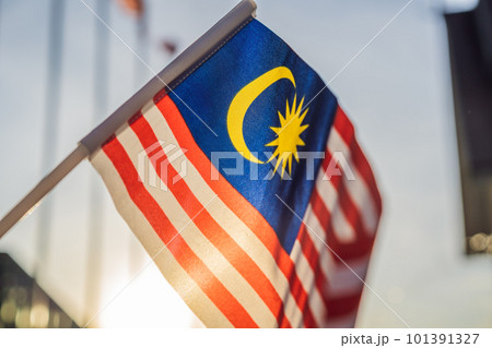Malaysia flag also known as Jalur Gemilang wave with the blue sky. People fly the flag in conjunction with the Independence Day celebration or Merdeka Day 101391327