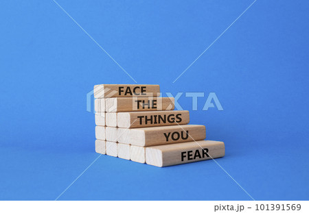 Face the things you fear symbol. Wooden blocks with words Face the things you fear. Beautiful blue background. Business and Face the things you fear concept. Copy space. Face the things you fear symbol. Wooden blocks with words Face the things you fear. Beautiful blue background. Business and Face the things you fear concept. Copy space. 101391569