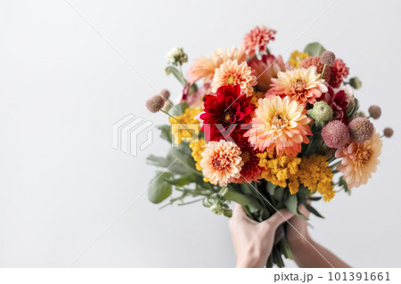 Female hand holds beautiful bouquet of dahlias and chrysanthemums. Mothers day, holiday decor, Flower delivery concept. Generative AI illustration 101391661