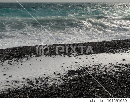 Pebble beach of Nice, France with azure waves of mediterranean sea 101391680