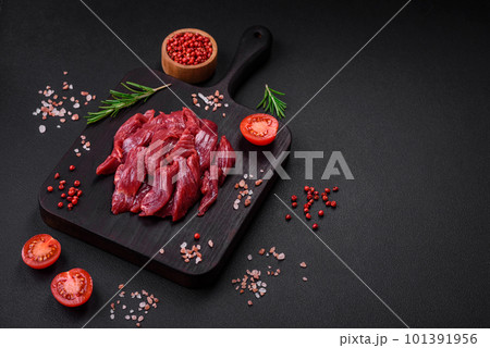 Fresh raw beef with salt, spices and herbs Fresh raw beef with salt, spices and herbs 101391956
