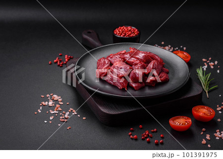 Fresh raw beef with salt, spices and herbs Fresh raw beef with salt, spices and herbs 101391975