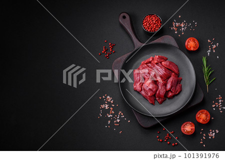 Fresh raw beef with salt, spices and herbs 101391976